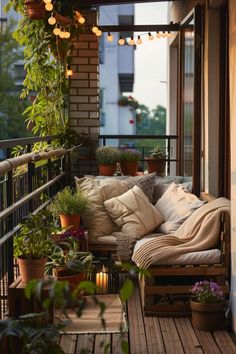 a balcony with lots of potted plants and lights hanging from it's ceiling