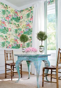 an image of a table and chairs with wallpaper on the walls in this room