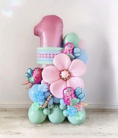 the balloon bouquet is made up of balloons and flowers