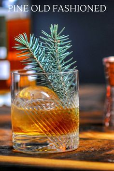 pine old fashioned whiskey in a glass on a wooden table