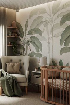 a baby's room with a chair, crib and wallpaper