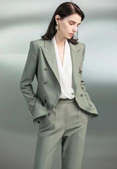 Sage Sophisticate Tailored Suit Exude quiet confidence with our Sage Sophisticate Tailored Suit. Crafted from the finest fabrics, this suit combines traditional tailoring and modern finesse. Its muted sage hue embodies the calm and collected professional, while the sharp, clean lines ensure a silhouette that speaks vol Green Suit Women, Muted Sage, Crisp White Blouse, Modern Suits, Quiet Confidence, Tailored Suit, Green Suit, Suit Women, The Calm