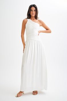 Best DressedThe JENNA One Shoulder Pleated Maxi Dress is a stunning and elegant choice for any special occasion. Featuring a chic one-shoulder design and an asymmetrical waistline, this dress beautifully accentuates your silhouette. The pleat detailing on the bodice adds a touch of sophistication, while the full gathered skirt flows gracefully to a maxi length. With a side zip for easy wear and a fully lined interior for comfort, the Jenna dress ensures you look effortlessly glamorous. One Shoulder Maxi Dress With Ruched Bodice, Elegant Asymmetrical Maxi Dress With Ruched Bodice, Elegant Ruched One Shoulder Dress For Wedding, One-shoulder Maxi Dress With Ruched Bodice, Ruched One-shoulder Dress For Wedding With Asymmetrical Neckline, Chic One Shoulder Maxi Dress For Wedding Guest, One Shoulder Dress With Ruched Fitted Bodice, White One Shoulder Ruched Dress, Chic White One-shoulder Dress For Prom