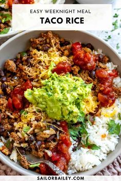 a white bowl filled with taco rice and guacamole