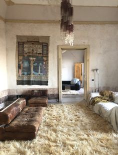 a living room filled with furniture and a rug