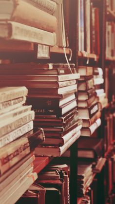 many books are stacked up on the shelves