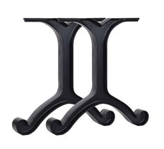 a black metal table with two legs on each side and one leg in the shape of an x