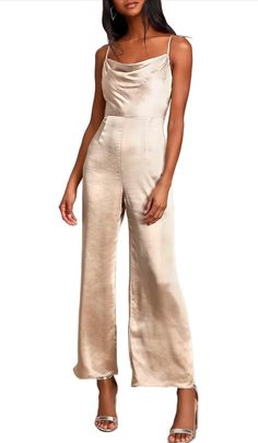 Indulge in ultimate luxury with our Satin Cowl Neck Culotte Jumpsuit. Crafted from gorgeous woven satin, this jumpsuit features a cowl neckline and wide-cut culotte style pants for a chic, sophisticated look. With a darted waist and adjustable straps, it offers a flawless fit for any cup size. Perfect for any occasion, this jumpsuit is a must-have for the fashion-forward. Culotte Style, Dress Layer, Party Sale, Culotte Jumpsuit, Cowl Neckline, Style Pants, Cup Size, Cowl Neck, Fashion Forward