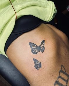 two butterflies on the back of a man