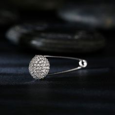 Elevate any look with this sparking accented ball safety pin brooch. Crafted in sterling silver, a sparking ball is set on the end of this safety pin-style brooch. Our unique and very chic safety pin is a super cute way to add a hint of sparkle to any ensemble any day of the week. And because this brooch is clear, it will match perfectly with every outfit in your closet.Weight: 1.54 gWidth: 10.7 mmHeight: 33 mmThickness: 5.7 mmMaterial: Plating Color: Wedding Brooch In Safety Pin Shape, Elegant Safety Pin Shaped Brooches For Gifts, Elegant Silver Brooch With Screw Back, Silver Safety Pin Brooch As Gift, Safety Pin Design, Gold Safety Pin Shaped Brooch Jewelry, Silver Safety Pin Shaped Brooch, Safety Pin Brooch, Pin Design