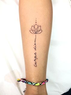 a woman's leg with a tattoo on it