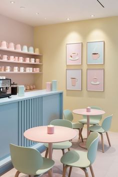 the interior of a coffee shop with pastel colors