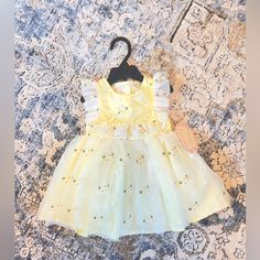 Such A Sweet And Beautiful Dress, Nwt For Your Baby Girl. Would Be A Stunning Easter Or Flower Girl Dress, Or Just A Beautiful Every Day Summer Dress. Comes With Matching Bloomers. Yellow Sweet Dress With Ruffles, Yellow Dress For Spring Dress-up Events, Yellow Dress For Spring Dress-up Occasions, Sweet Yellow Sleeveless Dress, Sweet Sleeveless Yellow Dress, Cute Yellow Dress For First Birthday, Yellow Summer Play Dress, Yellow Summer Dress For Play, Fitted Yellow Dress For Playtime