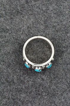 This turquoise and sterling silver ring was made by Navajo silversmith Paul Largo. The inside is stamped sterling.Size: 10Length: 1/2"Free shipping on all orders! We ship with USPS and always include tracking. All orders ship within a day of payment.Returns are accepted up to 30 days after you receive your order. Just send us a message. Our shop offers cash back or store credit. The item must be returned in new condition. Sterling Silver Turquoise Ring With Concho, Sterling Silver Turquoise Rings With Concho Detail, Turquoise Sterling Silver, Sterling Silver Ring, Silver Ring, Sterling Silver Rings, Silver Rings, Size 10, Turquoise