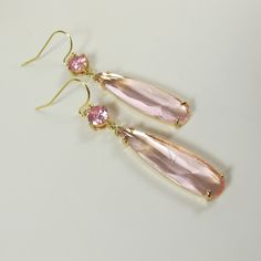 Soft Pink Crystal Earrings, Gold Dainty Pink Teardrop Earrings, Sparkly Dangle Earrings, Wedding Jewelry, Bridesmaid Gift, Pink Earrings. These beautiful and elegant drop earrings made with high quality, sparkly 24k gold framed, faceted pink glass crystals hang from tarnish resistant French ear hooks. These earrings are classic and elegant. Will make an excellent gift for yourself or friends. Measurements: The total length from the top of the hook to bottom - 2.04 inches (52 mm) approximately. C Feminine Drop Earrings For Bridal Party, Feminine Dangle Bridal Earrings For Party, Formal Pink Chandelier Earrings, Elegant Pink Dangle Crystal Earrings, Elegant Pink Chandelier Earrings For Formal Occasions, Elegant Pink Long Drop Earrings, Elegant Pink Chandelier Earrings For Formal Events, Elegant Pink Bridal Earrings, Dangle Teardrop Earrings For Bridesmaids