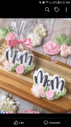 two decorated cookies in the shape of mom's and dad's day letters