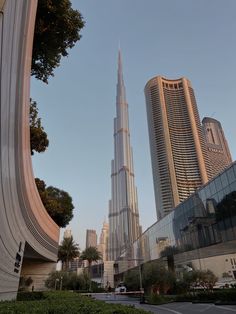 the burj building is surrounded by other tall buildings