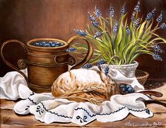 a painting of bluebells and an old fashioned milk jug on a table cloth