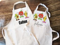 two personalized aprons with cartoon characters on them