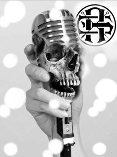 a person holding a microphone with a skull on it