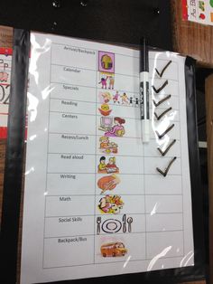 a clipboard with words and pictures on it