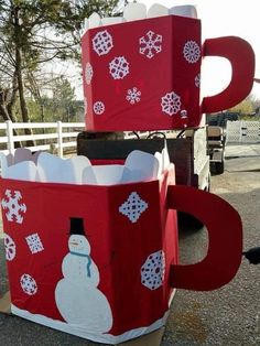 two large red boxes with snowmen on them