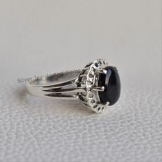 Gemstone-Black Onyx Shape-Oval Metal-925 Sterling Silver This One of a kind ring is adorned with beautiful Black Onyx gemstone in sterling silver.Black Onyx is the birthstone representing the month of December. About gemstone- Black Onyx is the birthstone for Leo. It is the stone of protection.This elegant smooth textured stone is said to have immense healing and spiritual benefits.Black Onyx symbolizes peace,harmony and love and good luck.Black Onyx is well known to remove negativity and act as Silver Onyx Signet Ring Gift, Sterling Silver Black Onyx Rings, Elegant Onyx Rings Hallmarked, Silver Onyx Gemstone Signet Ring, Adjustable Silver Onyx Ring, Birthstone Promise Rings, Black Onyx Ring, Rings Cool, Ring Photos