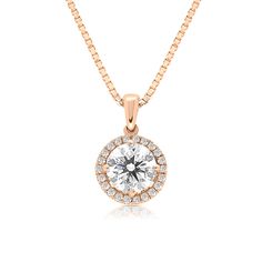 Surprise the one you adore with this classic 18K rose gold round brilliant cut diamond pendant necklace. The shimmering pendant showcases a classic natural round diamond artfully set to enhance size and sparkle - wrapped in a pave-lined diamond halo. This radiant look is one she'll turn to often, everyday and on special occasions. An amazing and thoughtful anniversary gift for your loved one.
1.12 Classic Halo diamond pendant set in 18K rose gold
Center Diamond: 

Weight: 1.01
Sha Rose Gold Moissanite Round Pendant Necklace, White Diamond Necklace With Round Cut Halo Design, White Solitaire Necklace With Halo Design, Diamond White Solitaire Necklace With Halo Design, Classic Halo Diamond Necklace With Round Pendant, Classic White Diamond Necklace With Halo Design, White Diamond Necklace With Halo Round Pendant, Diamond Necklace With Halo Design And Round Pendant, White Halo Diamond Necklace With Round Pendant