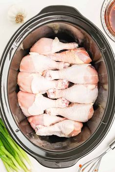 raw chicken in an air fryer with garlic and seasoning