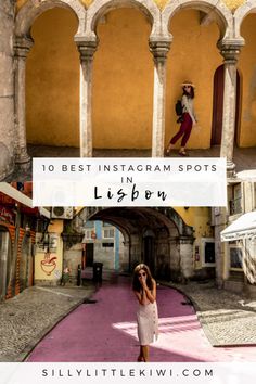 a woman taking a selfie in the middle of an alley way with arches and arches