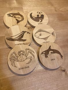 six wooden coasters with different types of animals on them