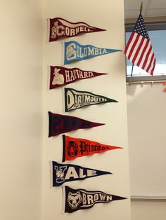 a group of pennants hanging from the side of a wall