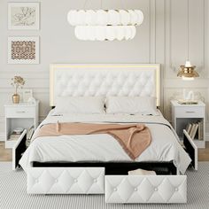 a white bed with an upholstered headboard and foot board is shown in this modern bedroom