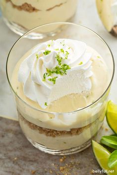 two desserts with lime and whipped cream in glass dishes