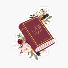 a law book surrounded by flowers and leaves sticker on a white background with the word law written in gold