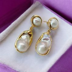 🌟Elevate your elegance with our stunning White Keshi Pearl Stud Earrings. Featuring gold-plated settings and baroque pearls, these earrings are perfect for weddings and special occasions. The unique nucleated flameball design adds a touch of luxury and sophistication, making them an ideal gift for women who appreciate timeless beauty. ✨ Features:  * Gold-plated stud earrings  * Genuine white Keshi baroque pearls  * Unique nucleated flameball design  * Perfect for weddings and special occasions Luxury Handmade Traditional Pearl Earrings, Exquisite Gold Clip-on Earrings, Plated Dangle Earrings For Wedding, Luxury Gold Teardrop Bridal Earrings, Wedding Dangle Earrings, Plated, Luxury Plated Wedding Earrings, Gold-plated Drop Pearl Earrings, Clip-on, Elegant Plated Clip-on Earrings For Formal Occasions, Elegant Plated Clip-on Earrings For Formal Events