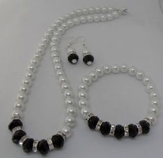 This is a beautiful classic white Czech glass pearl necklace, earrings and bracelet set. The white pearls, black faceted crystals and silver diamante spacers are all 8 mm.  The clasp is silver plated and magnetic making it easy to take on and off.  The necklace is approximately 18 ins long and the bracelet is on jewellers elastic  and fits most wrists. Please get in touch if you require a smaller or larger necklace or bracelet as I make to order.  The earrings are silver plated dangle earrings. Please note: If you require different coloured faceted glass crystals or pearls beads please get in touch as I have many other colours available. Large Necklace, Pearl Necklace Set, Pearl Necklace Earrings, Faceted Glass, Faceted Crystal, Bead Bracelet, Classic White, Pearl Beads, Bracelet Set