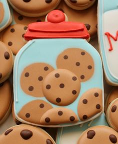 cookies with chocolate dots are arranged in the shape of a cookie jar and on top of each other