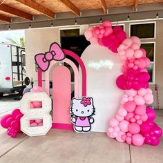 hello kitty balloon arch with pink and white balloons