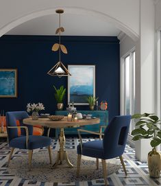 a dining room with blue chairs and a round table in the center, surrounded by potted plants