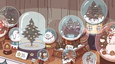 there are many snow globes on the table with christmas trees and animals in them