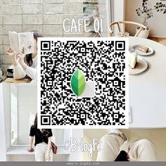 two people are sitting at a table and one is looking at a qr code