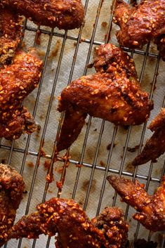 chicken wings on a baking sheet covered in sauce