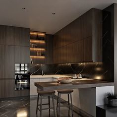 a kitchen with two stools next to an island and counter top in the middle