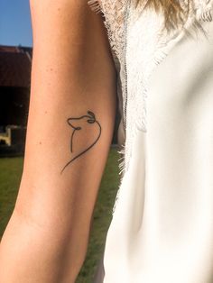 a woman with a small tattoo on her arm