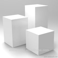 three white cubes sitting side by side