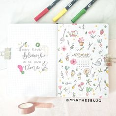 an open notebook with writing on it next to some markers and washi tapes