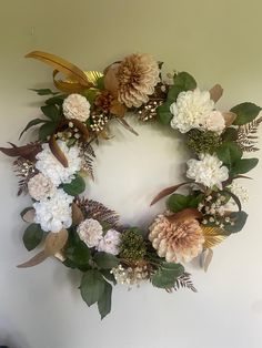 a floral wreath hanging on the wall