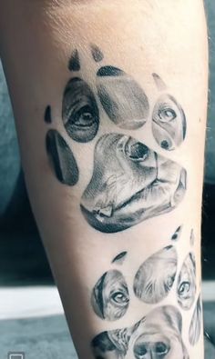 a person with a dog's paw tattoo on their leg and it has many different dogs