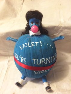 a blue painted pumpkin with the words violett you're turning violent on it